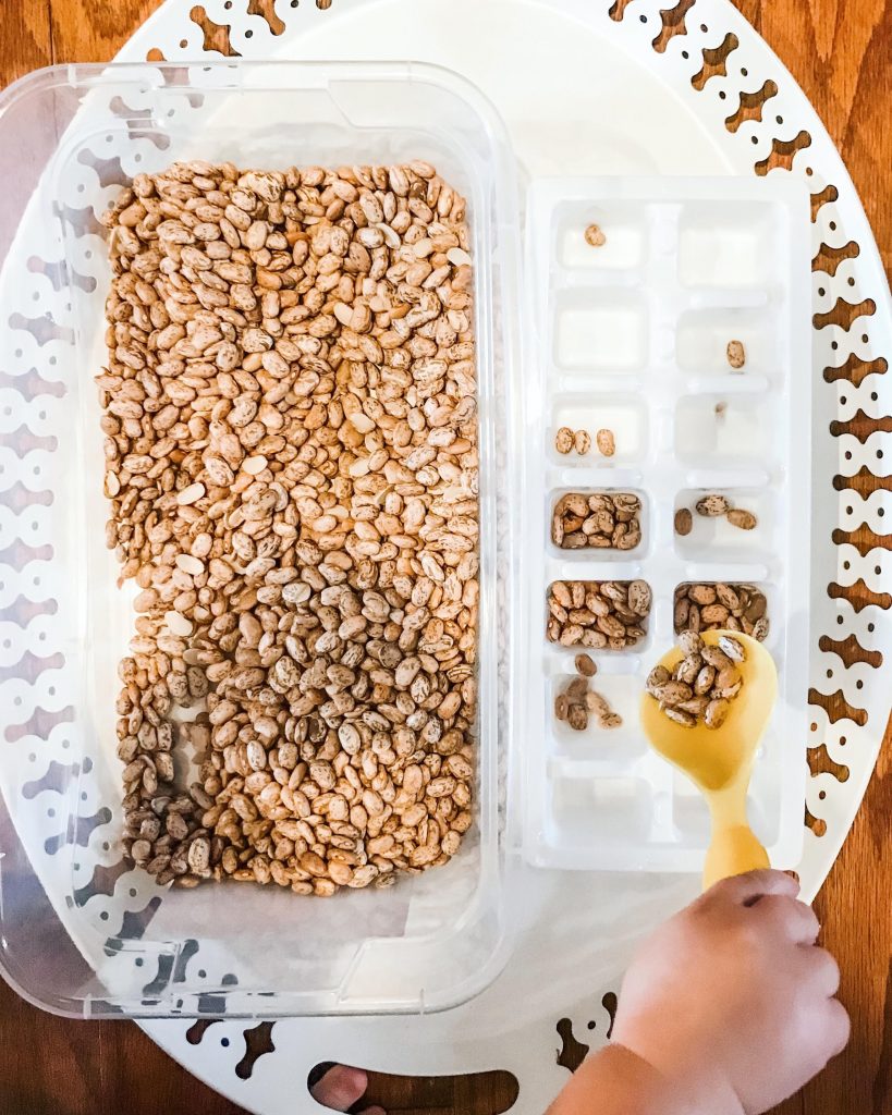 Easy scoop & pour sensory bin with beans